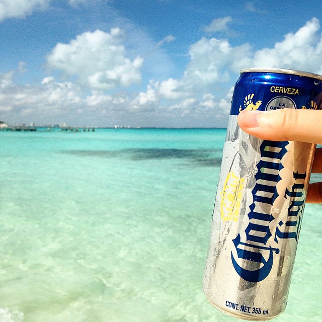 Corona on the beach in Cancun, Belize to Mexico backpacking itinerary