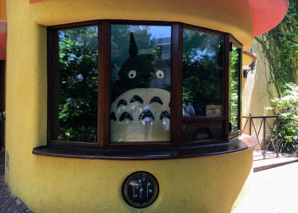 Visiting the Studio Ghibli Museum in Mitaka, Tokyo Japan. How to get there, get tickets, and tips on visiting Studio Ghibli! Totoro greeting at the entrance