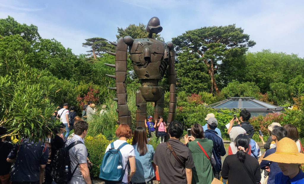 Visiting the Studio Ghibli Museum in Mitaka, Tokyo Japan. How to get there, get tickets, and tips on visiting Studio Ghibli! Totoro greeting at the entrance. Laputa friendly giant on the rooftop