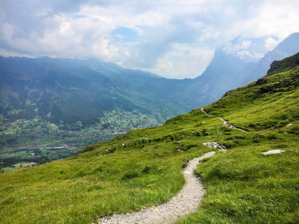 Hiking the Eiger trail in Switzerland, in the Swiss Alps. Between Kleine Scheidegg, Grindelwald, Lauterbrunnen, and Interlaken hike