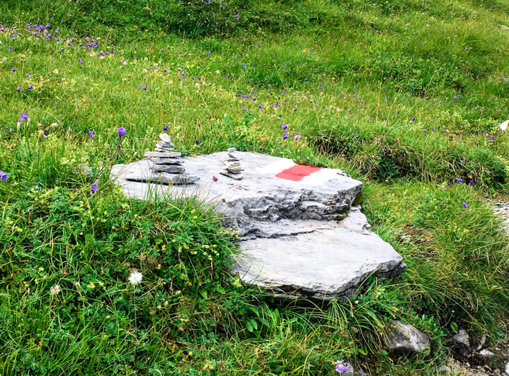 Hiking the Eiger trail in Switzerland, in the Swiss Alps. Between Kleine Scheidegg, Grindelwald, Lauterbrunnen, and Interlaken hike