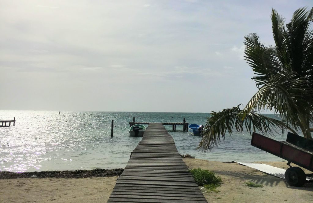 Caye Caulker Belize an island getaway. Less than three hours from America is Belize and Caye Caulker Island. Read where to stay, where to eat, what to do on Caye Caulker, Belize